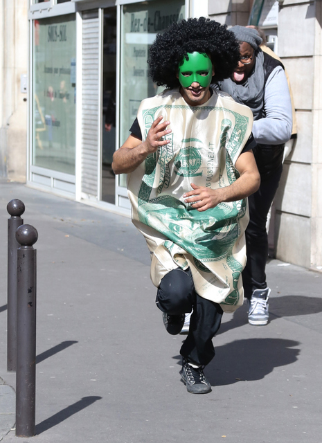 man in mask and wig running - rue lagrange